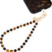 kate spade new york Phone Charm Wrist Strap w/Anchor Card - Tortoise Bead
